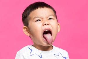 little boy sticking out tongue - Wyoming Department of Health