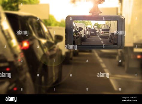 Modern dashboard camera mounted in car, view of road during driving ...