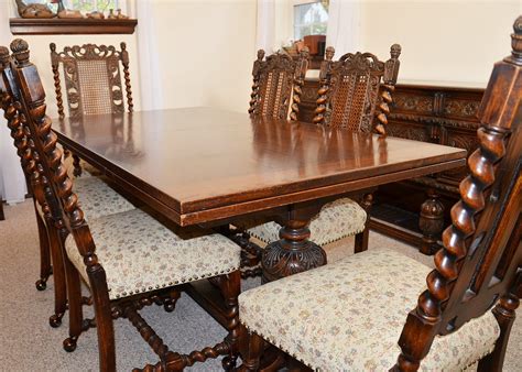 Early 20th Century Jacobean Revival Oak Dining Room Table and Chairs | EBTH