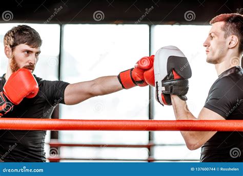 Man Training with Boxing Coach on the Boxing Ring Stock Photo - Image of fighter, kick: 137600744