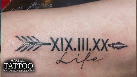 Elegant Roman Numerals Tattoo Design