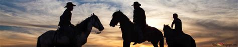 Cowboys at Sunset 4K wallpaper download