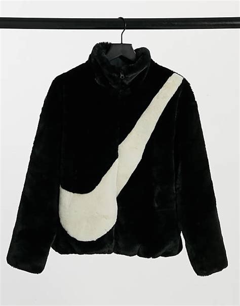 Nike faux fur oversized swoosh jacket in black | ASOS