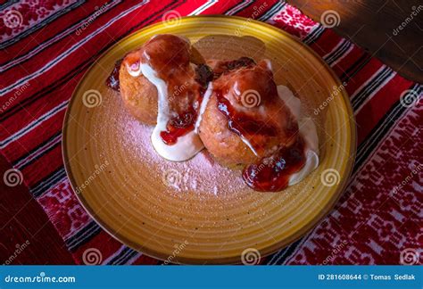 Papanasi - a Traditional Romanian Dessert. the Cake is Made from Three Donuts Covered in Sour ...