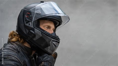 Motorcycle rider wears safety helmet, free space to insert Stock Photo ...