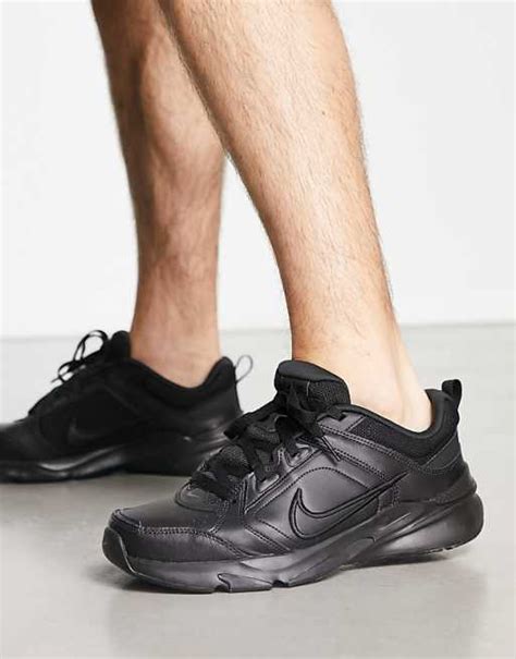 Nike Training Defy All Day trainers in black | ASOS