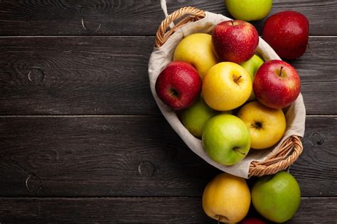 Premium Photo | Colorful ripe apple fruits in basket