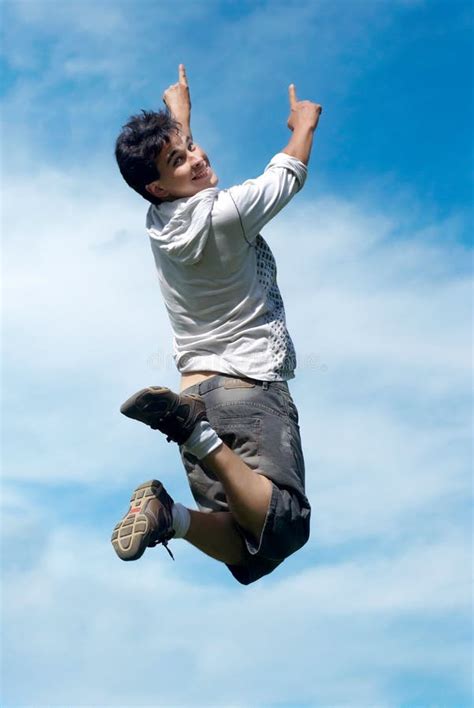 Happy guy jumping stock photo. Image of celebrate, lucky - 12331370