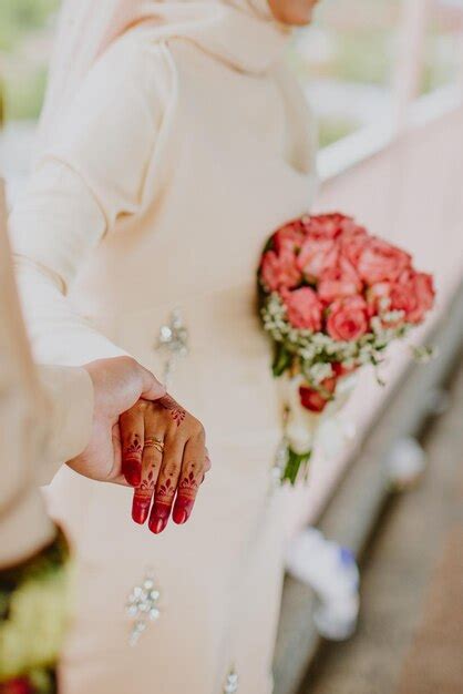 Premium Photo | Wedding couple holding hands.