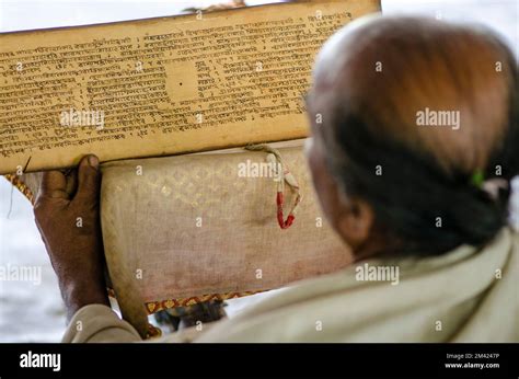 Monks of one of the Sattras, the Vaishnava Monasteries on Majuli Island, reciting from the holy ...