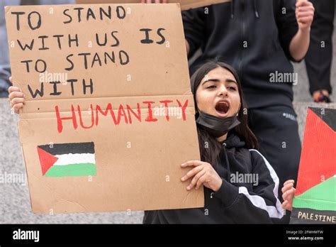 Young female Palestinian chanting and holding placard at an anti Israel ...