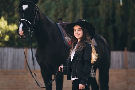 Free Photo | Girl with horse at ranch