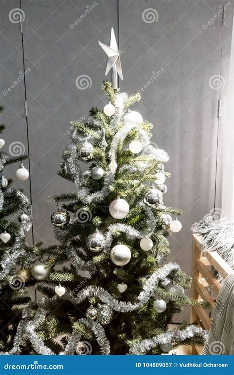 White and Silver Decorative Christmas Tree with Tinsel Garland, Stock Image - Image of product ...