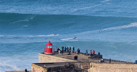 Nazare, Portugal - November 7, 2022 People watching the big giant waves in Nazare, Portugal ...