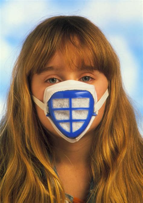 Child Wears Mask To Protect Against Air Pollution Photograph by Victor ...