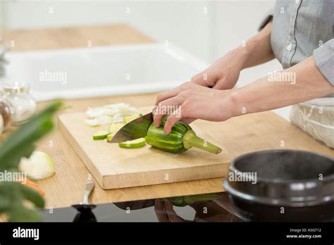 Single man cooking Stock Photo - Alamy