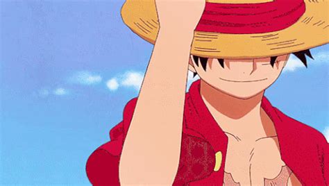 an anime character wearing a straw hat and holding his hand up to his head while looking at the ...