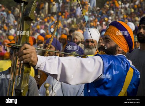 Sikh Nihang warrior displaying his archery skills during Hola Mohalla ...