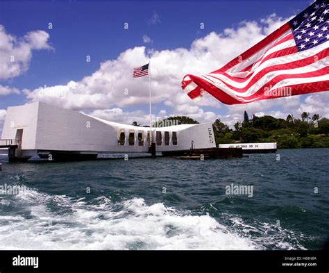 View of the USS Arizona Memorial in Pearl harbor with an American Flag ...