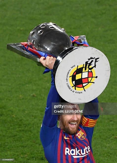 Barcelona's Argentinian forward Lionel Messi raises La Liga trophy as... News Photo - Getty Images