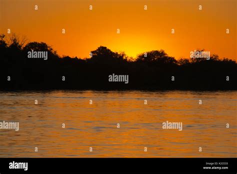 Sunset over Zambezi River Zambia Stock Photo - Alamy