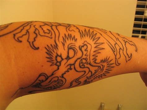 Colourless spiny, evil monster,sharp claws, forearm tattoo - Tattooimages.biz