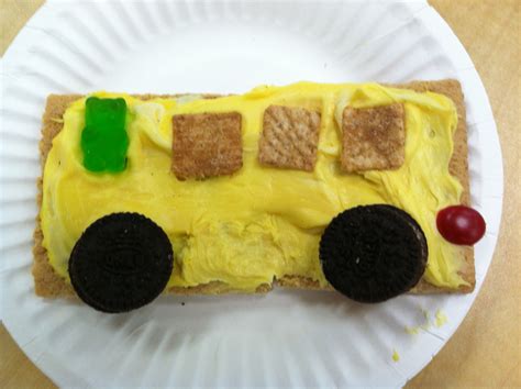 The Wheels on the Bus project made with graham crackers, frosting, gummy bear driver, mini oreos ...