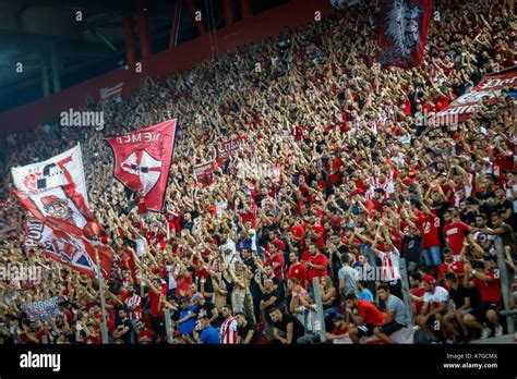 Piraeus, Greece - Sempteber 12, 2017: Olympiacos fans celebrating for their team during the UEFA ...