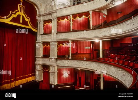 Side view of theatre boxes and stage curtain in the interior auditorium ...