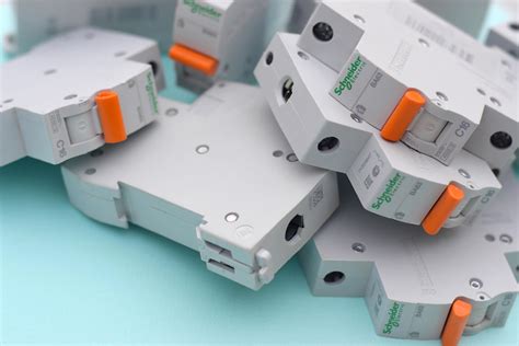 Schneider electric circuit breakers on light blue background. Schneider ...