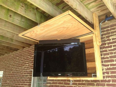 Outdoor tv cabinet. Swivel tv and mounted sound bar. # ...