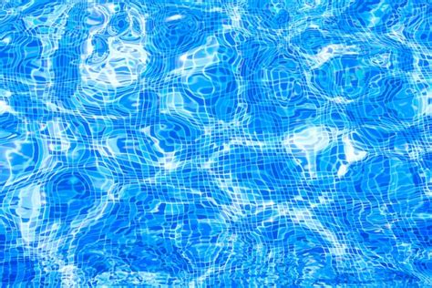 Premium Photo | Water in swimming pool blue background