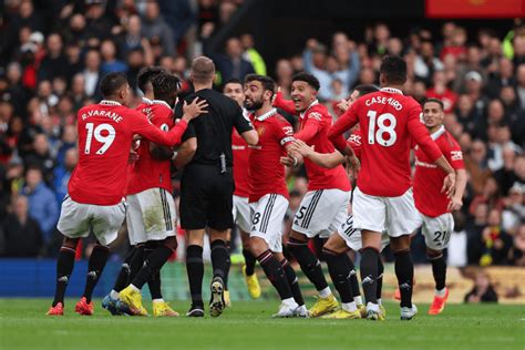 Manchester United charged by FA after players surrounded referee in ...