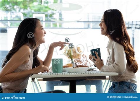 Two Young Asian Women Friends Talking at a Coffee Shop. Stock Photo - Image of group, friends ...