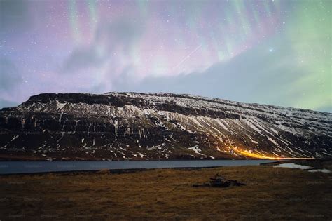 A mountain covered in snow under a purple sky photo – Mountain show Image on Unsplash