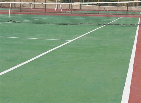 A Detailed View Of A Clay Tennis Court With Net Set Up Outdoors Photo Background And Picture For ...