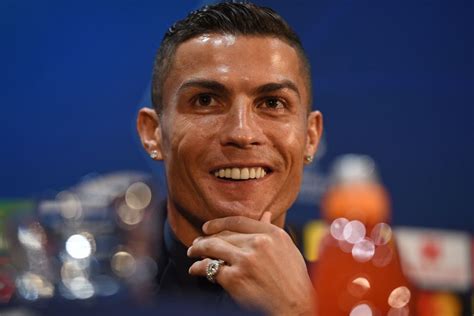 Juventus' Portuguese striker Cristiano Ronaldo smiles during a press ...