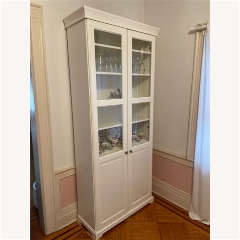 IKEA LIATORP Bookcase with Glass Doors in White - AptDeco