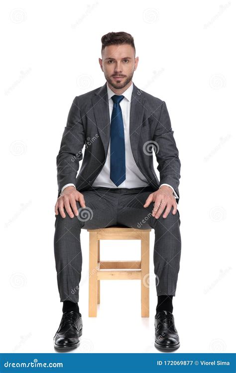 Serious Young Businessman Holding Hands on Knees Stock Image - Image of navy, knees: 172069877