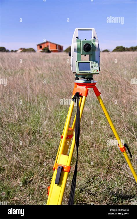 Total station. Survey Instrument geodetic device. Fall time land surveying, set in field. Modern ...