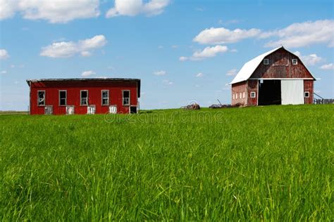 Farm in open grass field stock image. Image of blue - 146974975