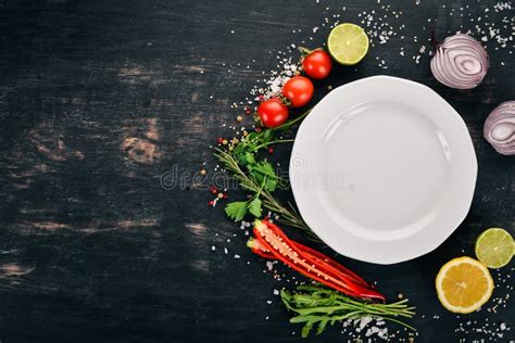 The Background of Cooking. Plate with Fresh Vegetables. on a Wooden ...