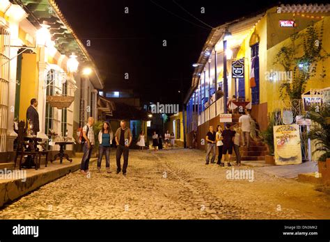 People on the street in Trinidad Cuba at night going to restaurants ...