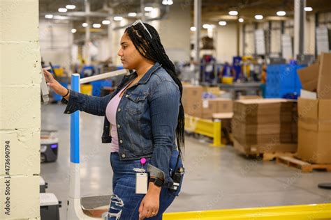 Employee punching Time Clock at Work Stock Photo | Adobe Stock