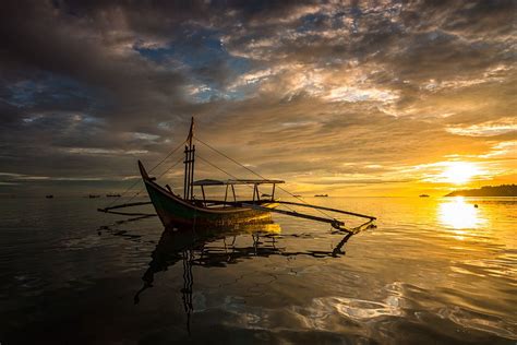 Sunset Behind | Sunset, Boat, Landscape features