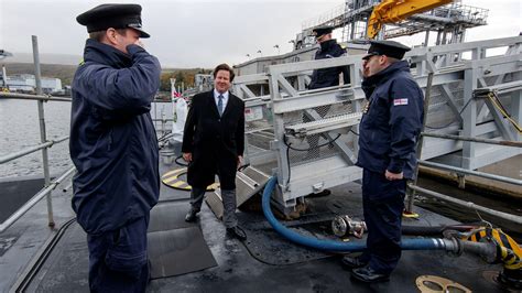 Navy submariners pictured wearing black caps for one of first times