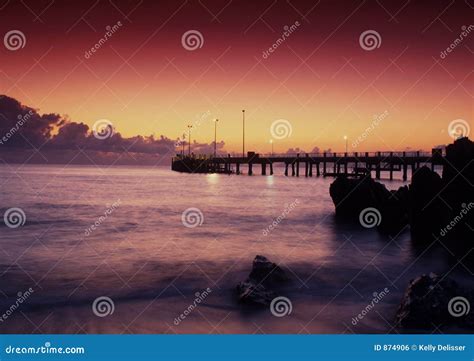 Jetty at sunset stock photo. Image of rocks, night, beach - 874906