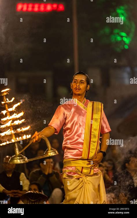 Ganga aarti, Portrait of an young priest performing river ganges ...