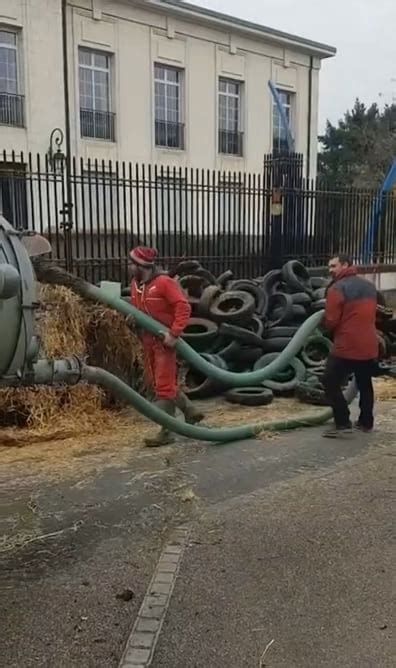 French farmers spraying manure on government offices in protest of high ...