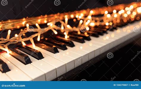 Christmas Lights on a Piano Keyboard Stock Image - Image of golden, bokeh: 104279887